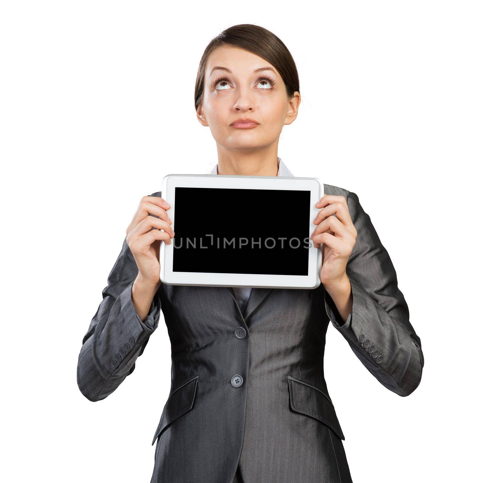 Businesswoman with tablet computer looking upwards. Portrait of attractive woman in formalwear showing tablet PC near her face. Corporate businessperson and digital technology layout with copy space