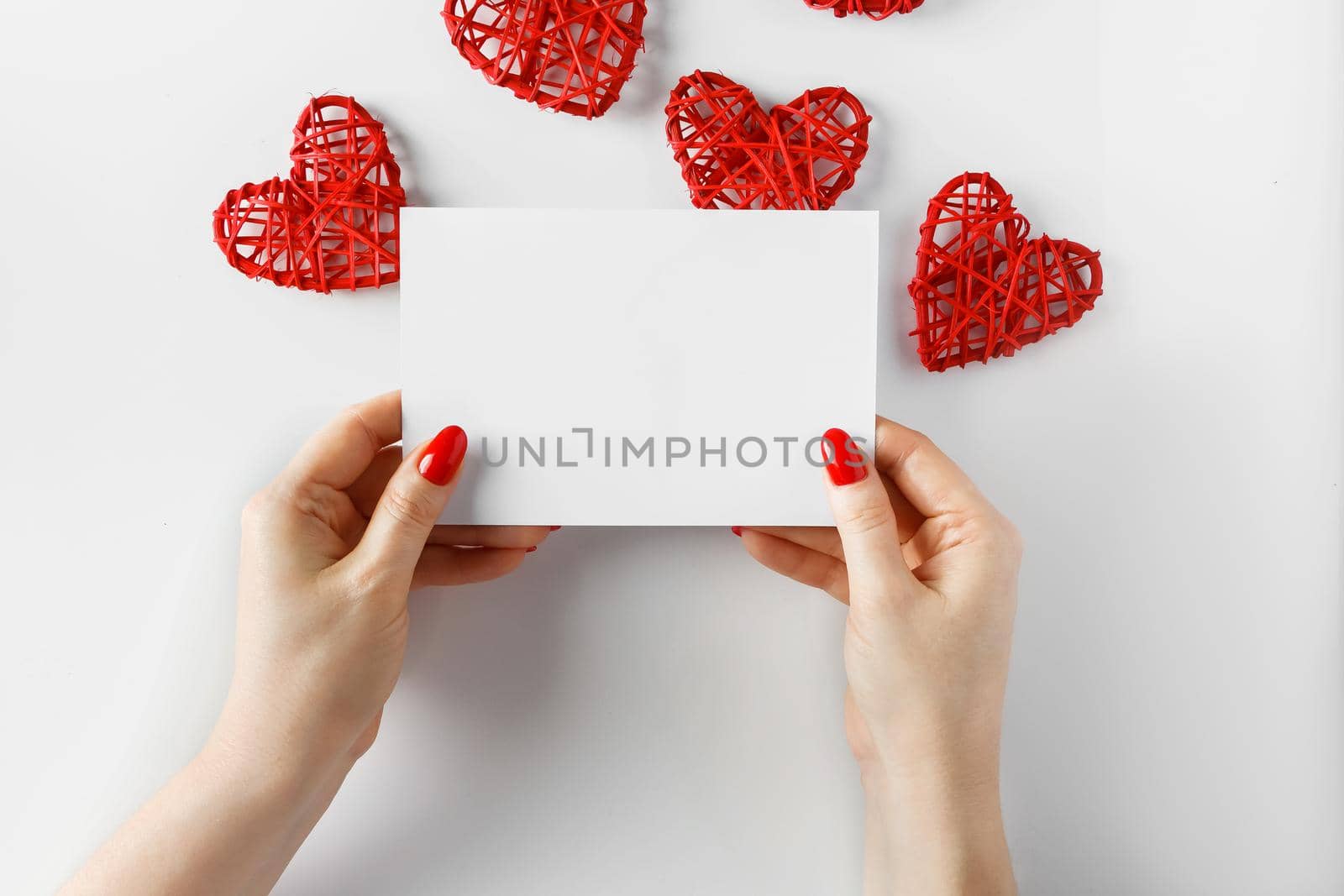 Envelope with a letter in hands on a white background by Statuska