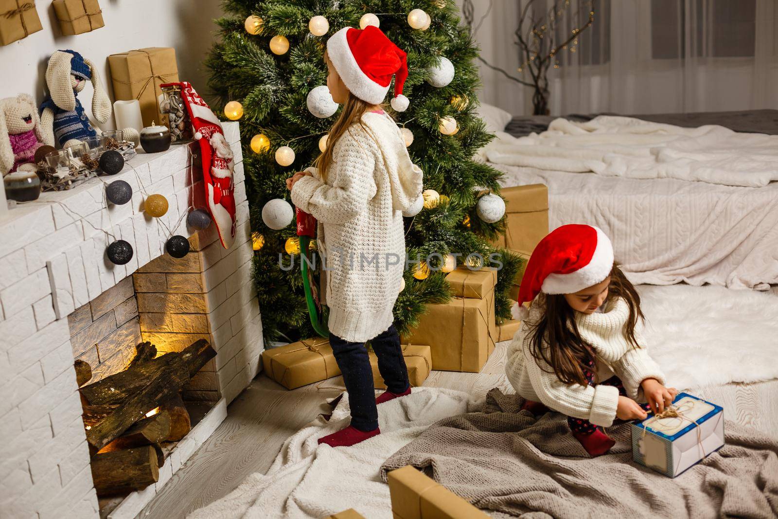 christmas, x-mas, winter, happiness concept - two adorable girls playing.