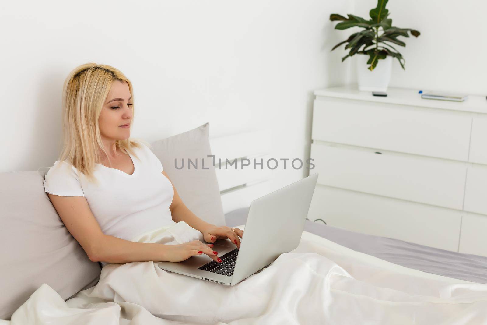Woman working behind laptop