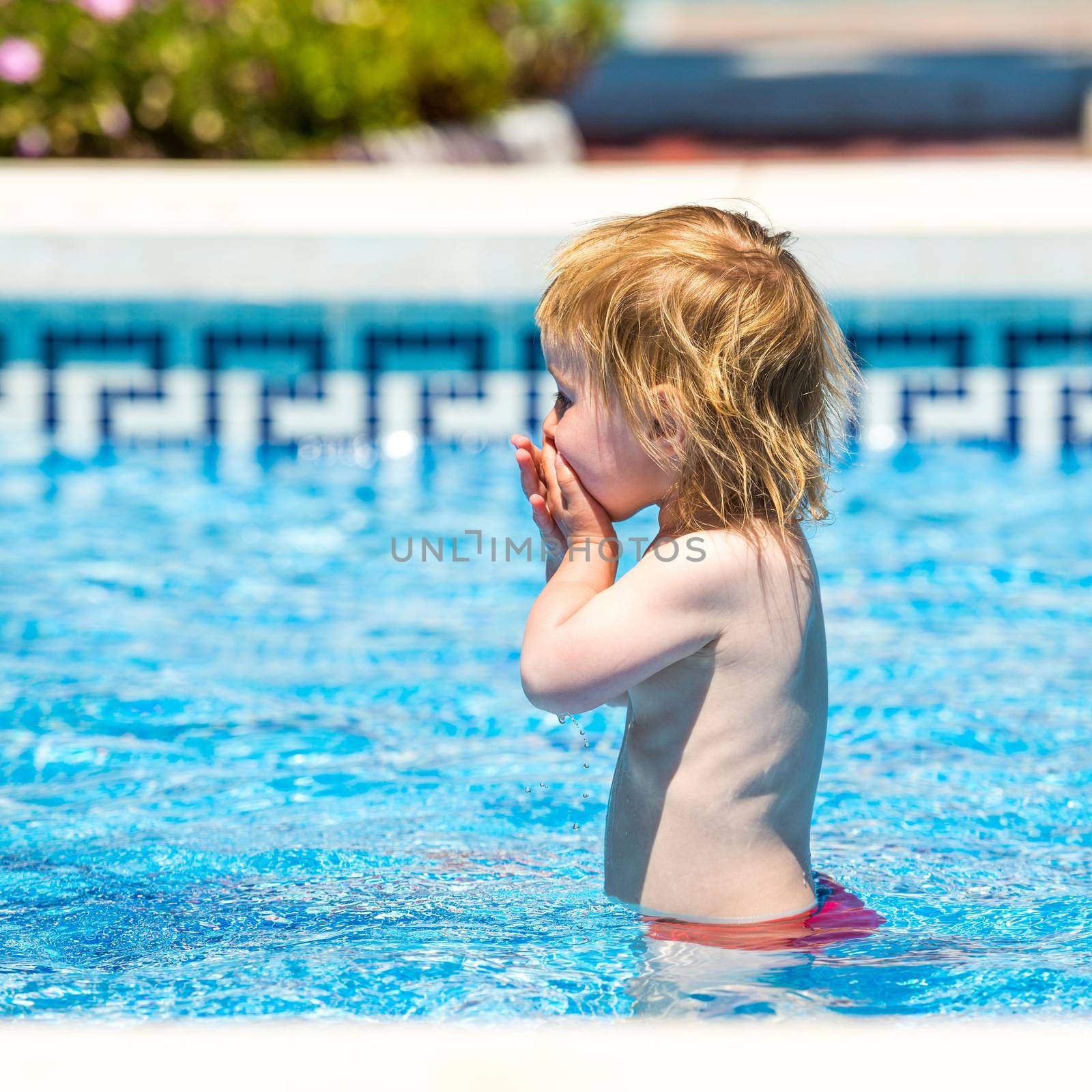 happy little girl in a wetsuit by tan4ikk1