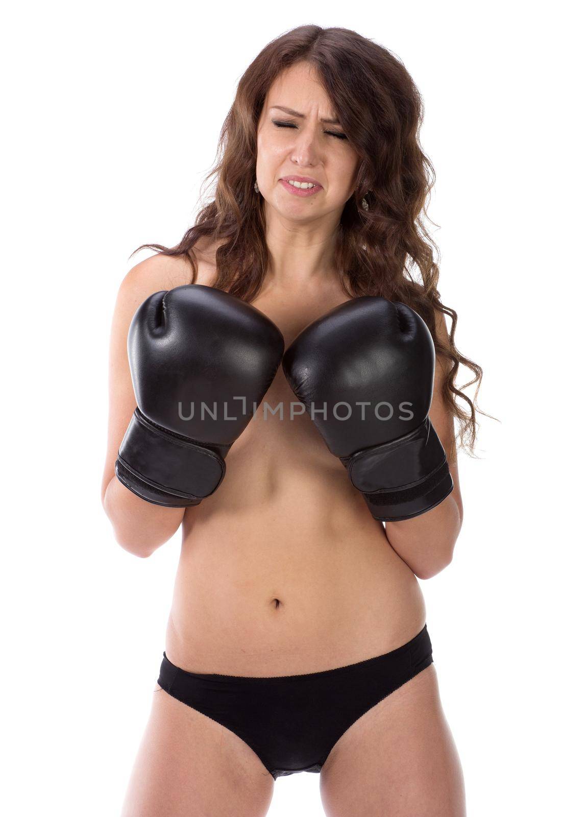 Sexy young brunette woman with black boxing gloves covering breasts by gsdonlin