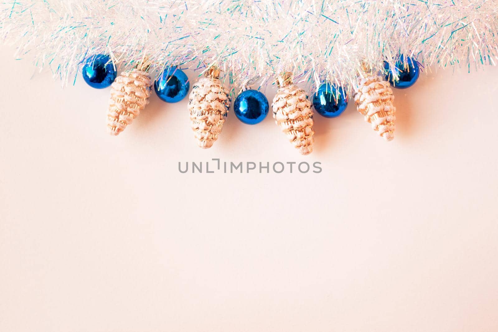Christmas composition.Christmas decorations in blue and gold on a beige background. Flat lay, top view, copy space.
