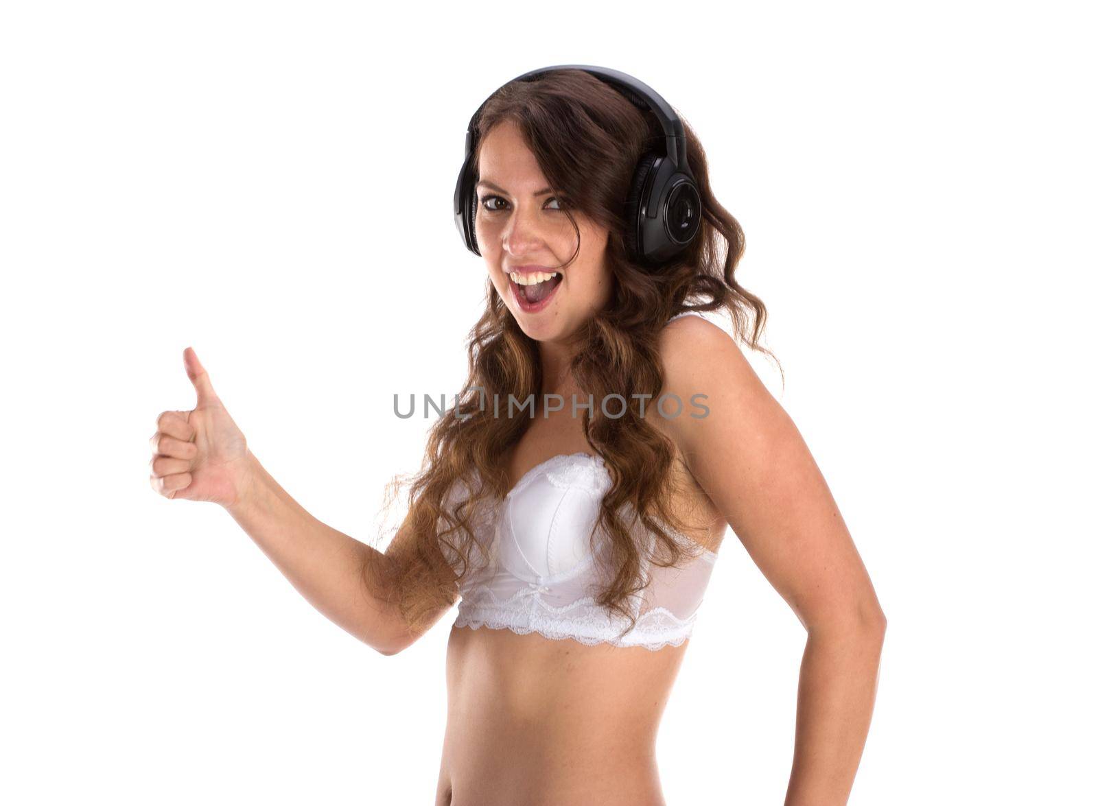 Attractive Sexy woman with beautiful body posing with headphones, isolated on white.