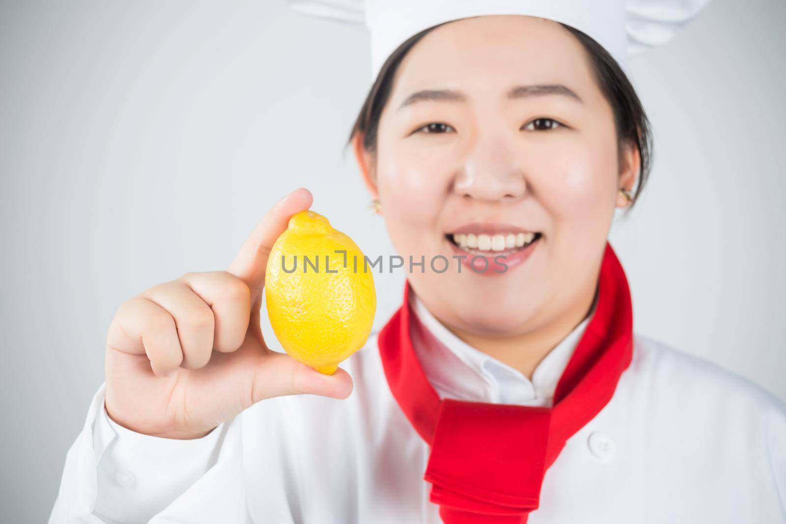 smiling female chef, holding a red apple by whatwolf