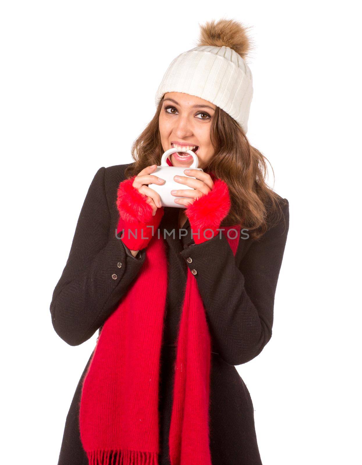 Pretty woman biting cups of big white cup. Isolated on white