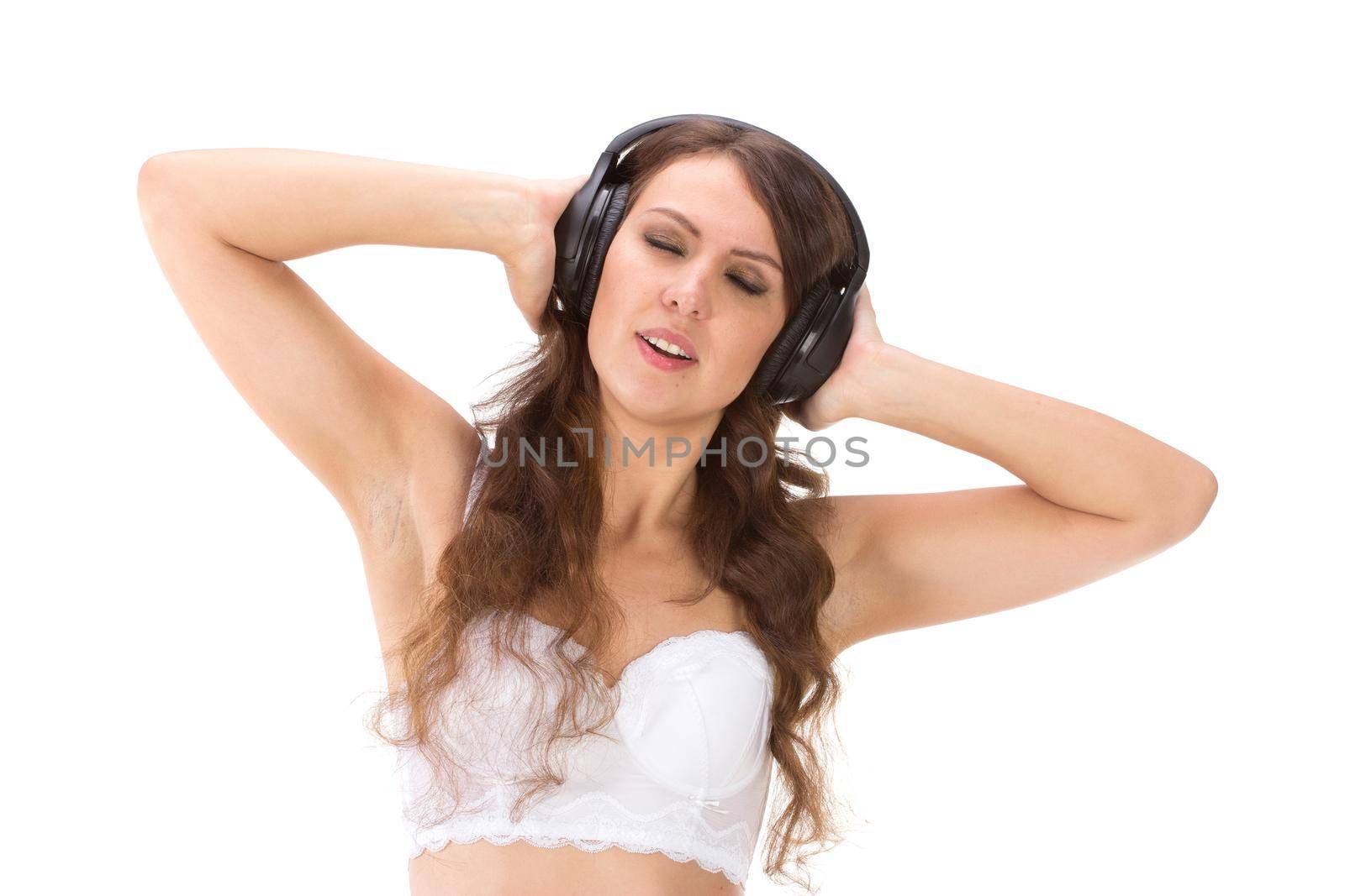 Attractive Sexy woman with beautiful body posing with headphones. by gsdonlin