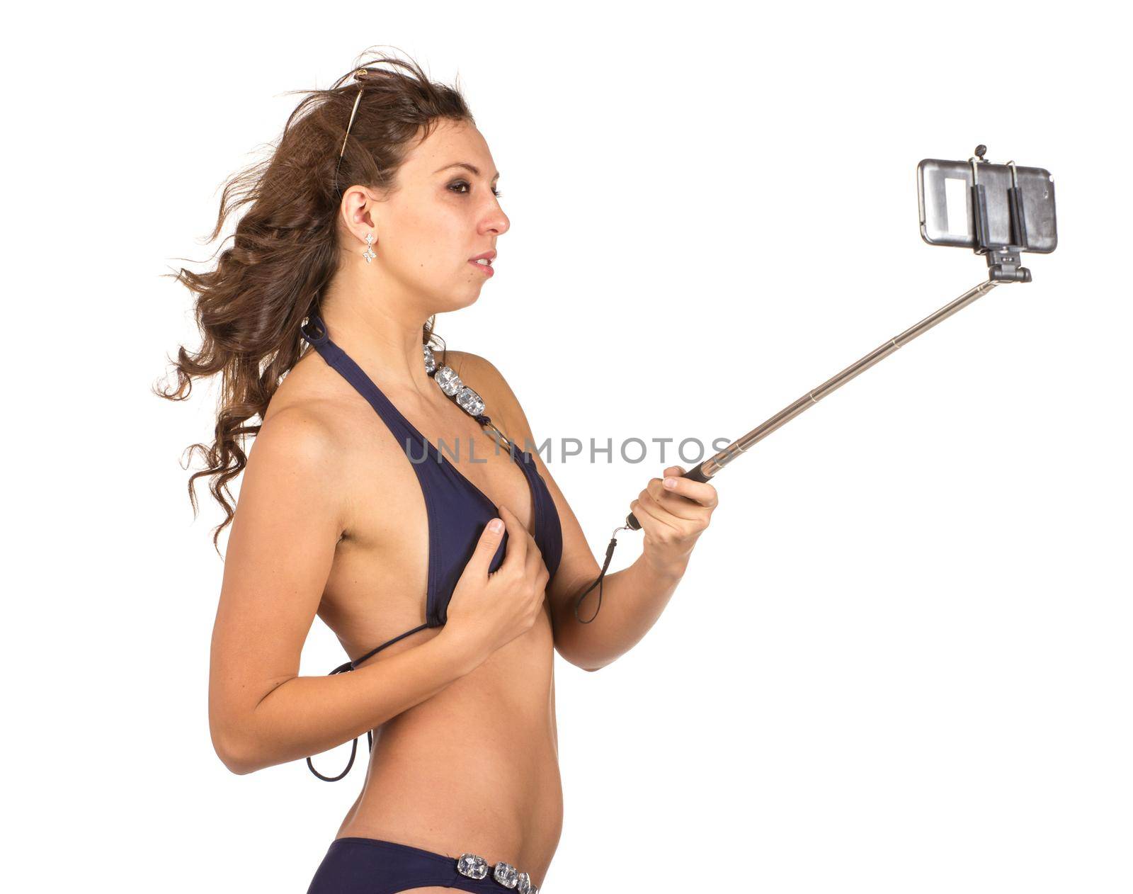 Woman in swimsuits taking a selfie. by gsdonlin