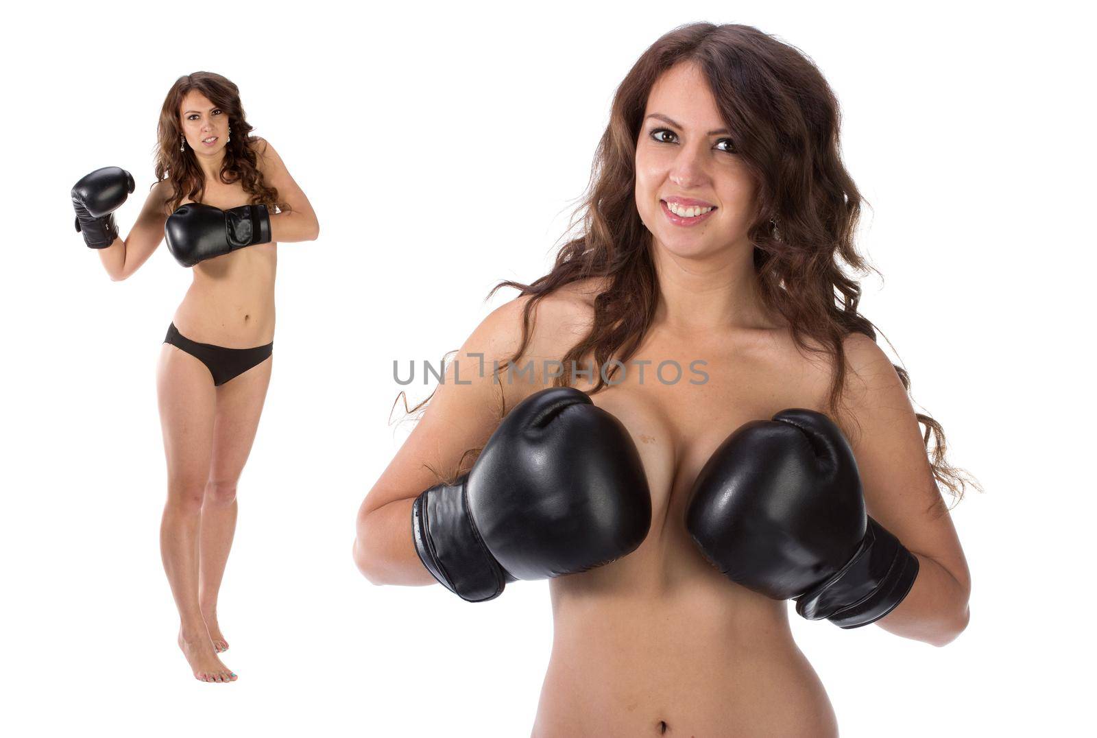 Sexy young brunette woman with black boxing gloves covering breasts, Isolated over white