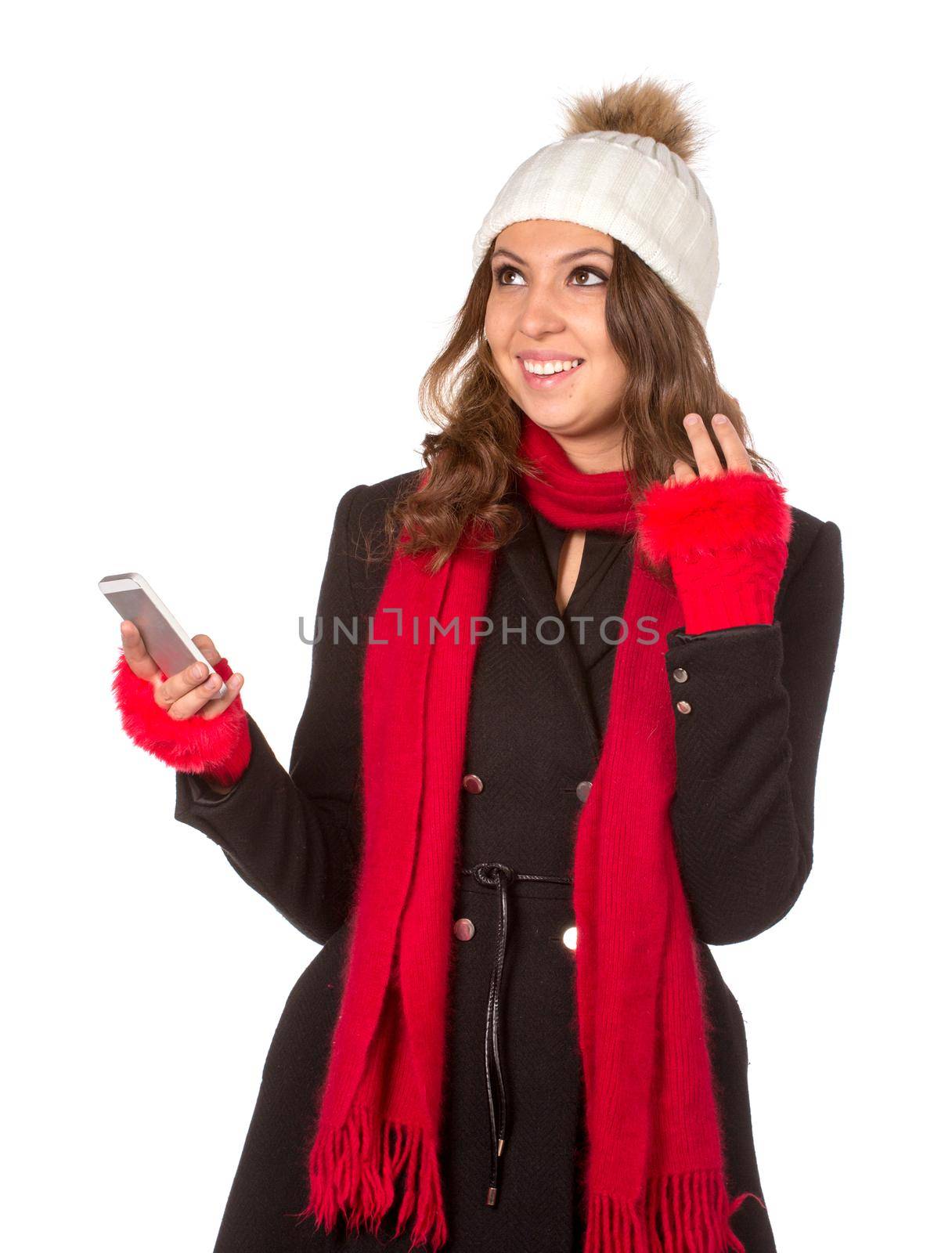 Portrait of the beautiful sexual girl in warm hat and coat on white background