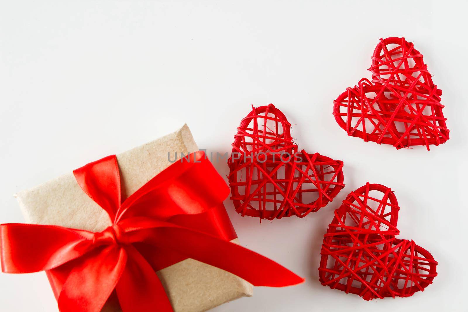 Valentine's day gift and red hearts on a white background by Statuska