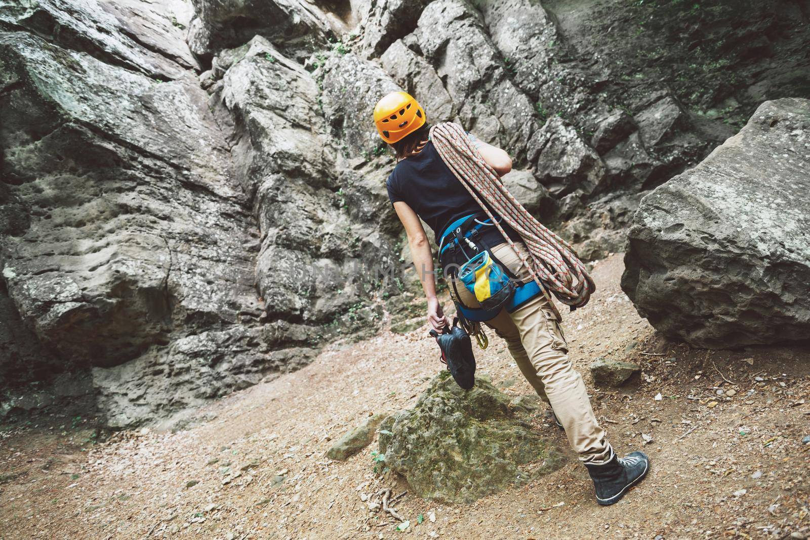 Woman with climbing equipment outdoor by alexAleksei