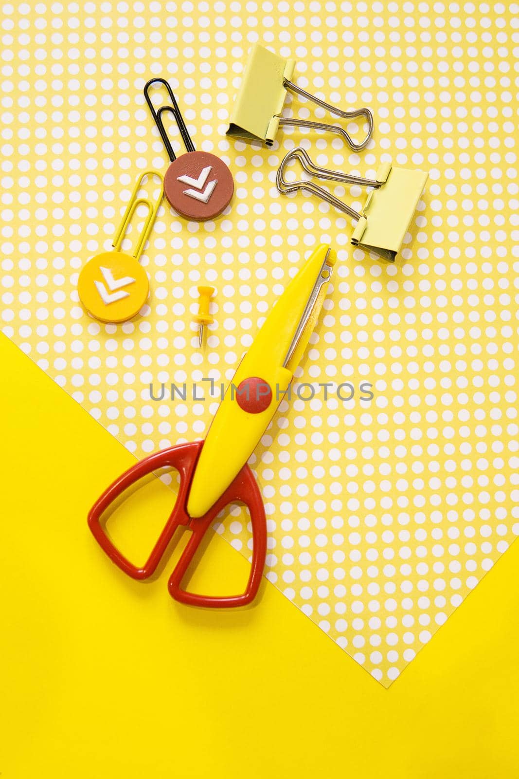 School supplies. Yellow and red colors. Flat lay composition. Yellow background. Space for text. Back to school.