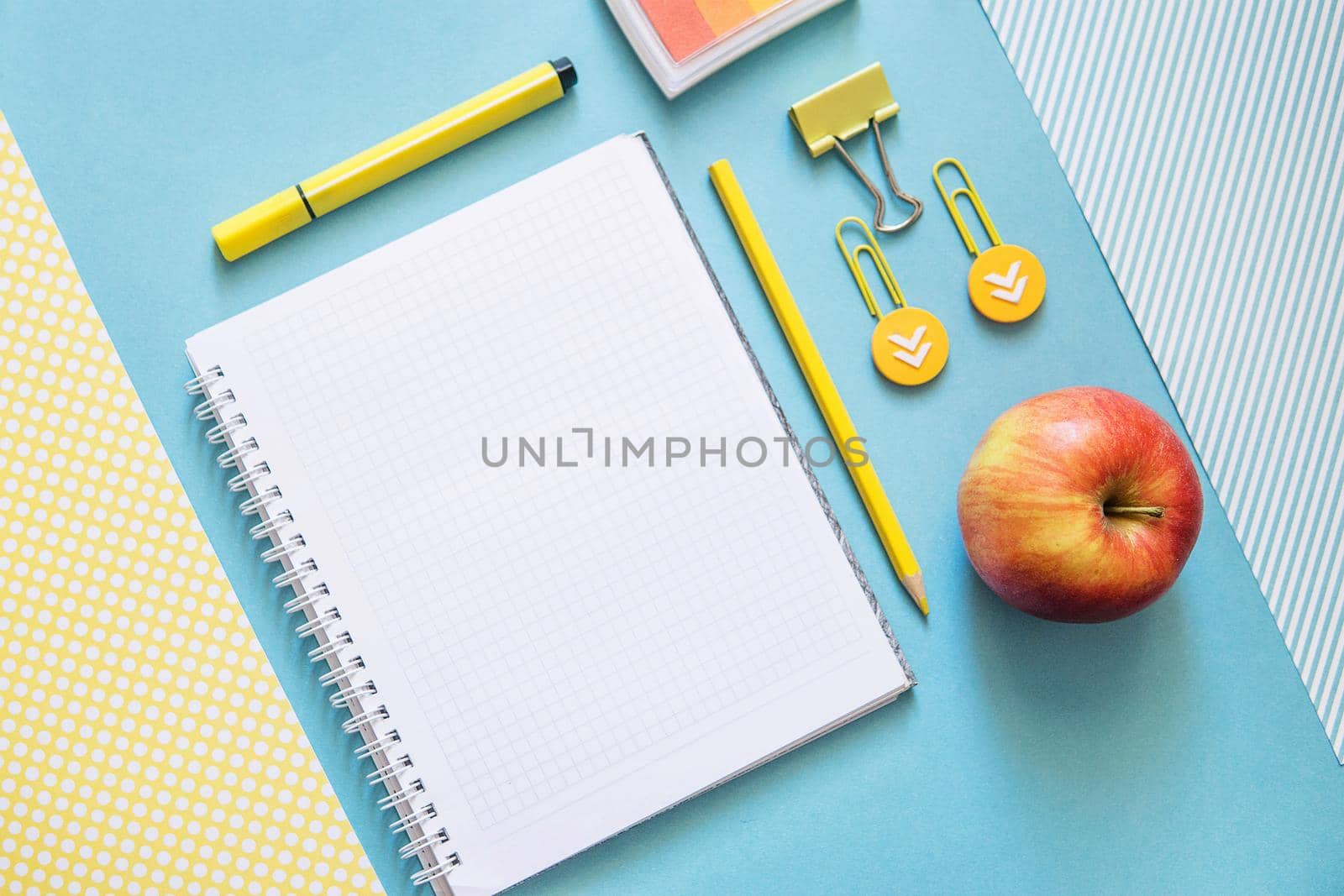 School supplies. Yellow and blue colors. Empty notebook. Flat lay composition. Space for text. Back to school.