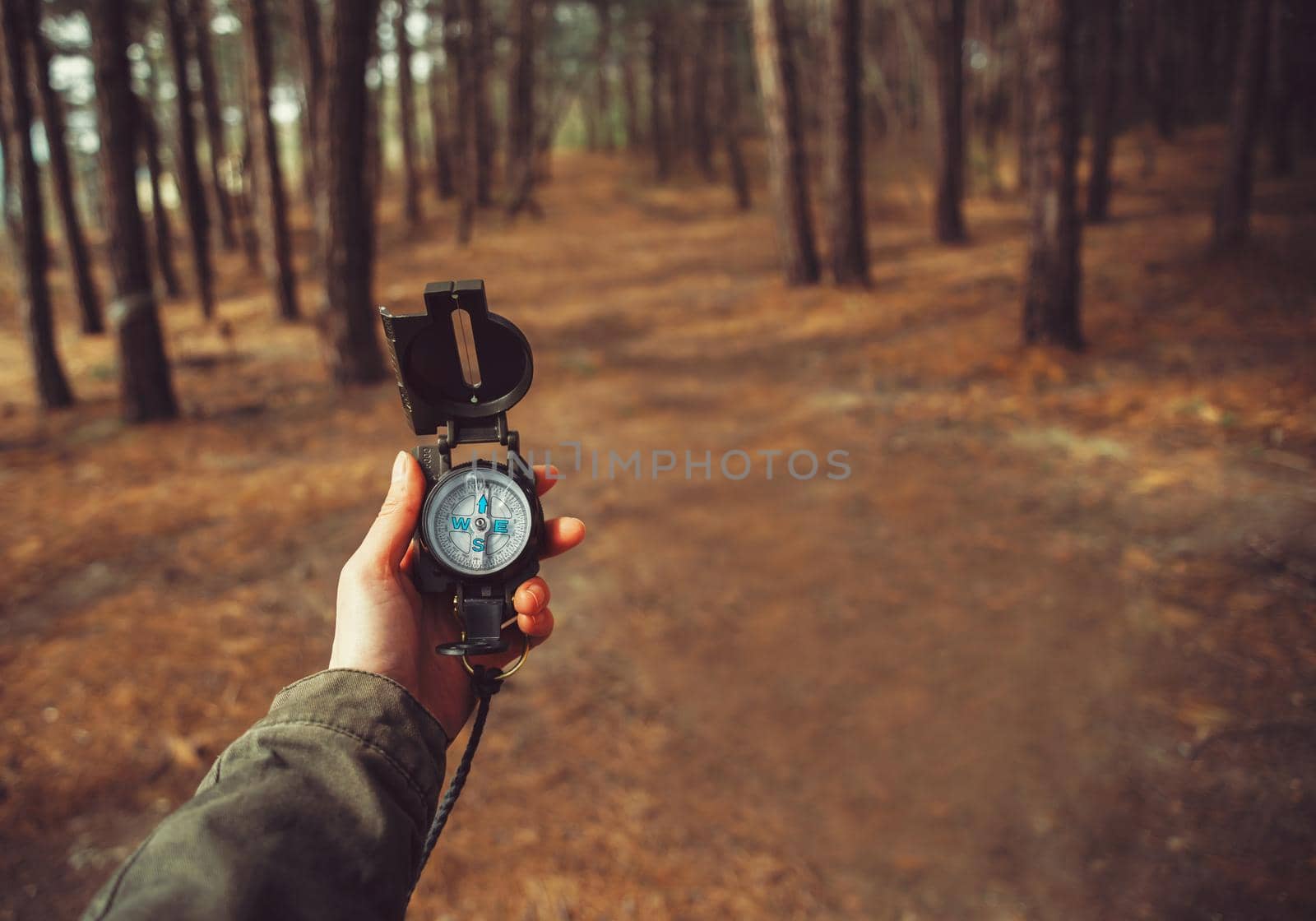 POV of hand with a compass by alexAleksei