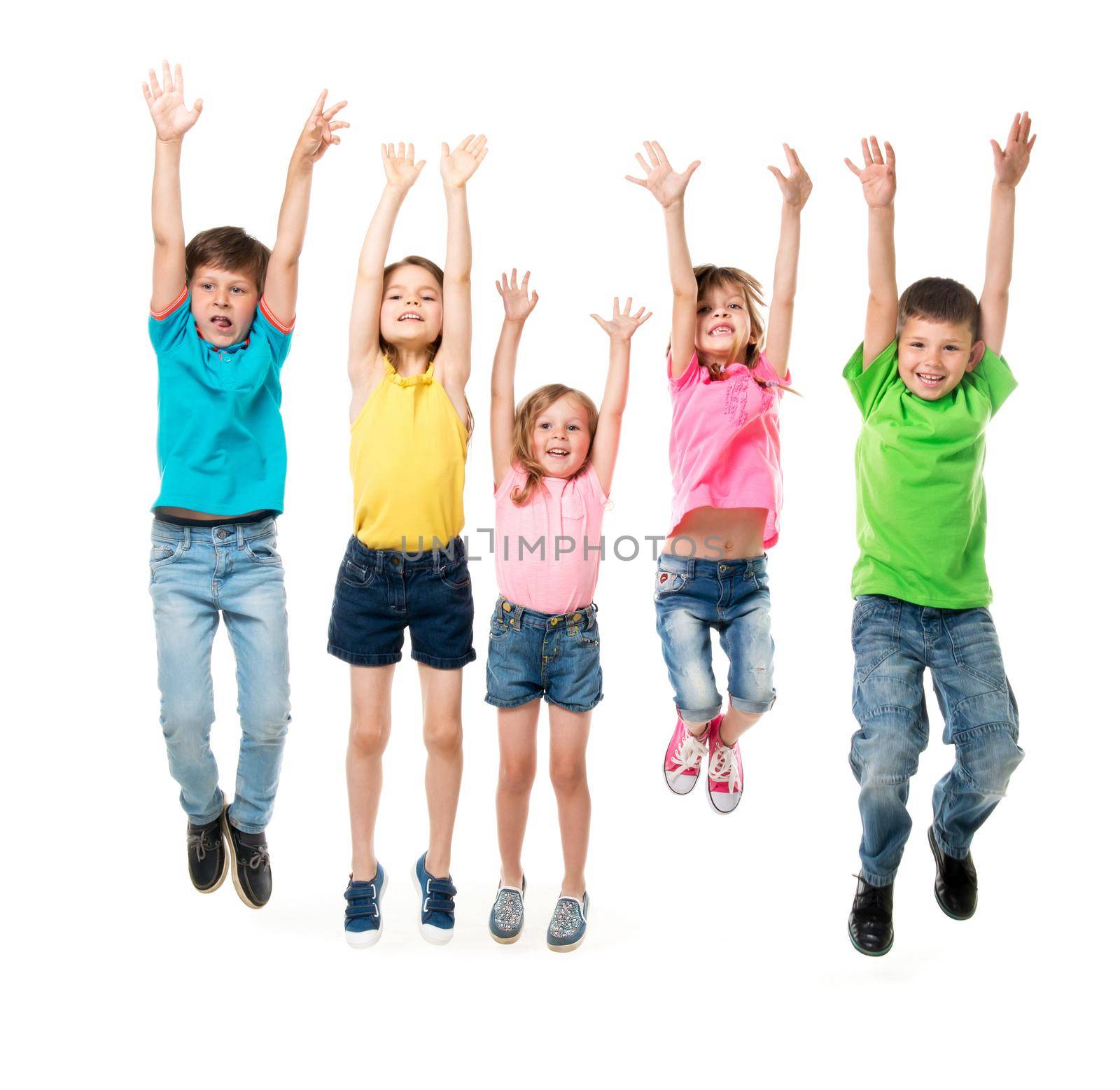beautiful children in colorful clothes jumping together with hands up isolated on white background