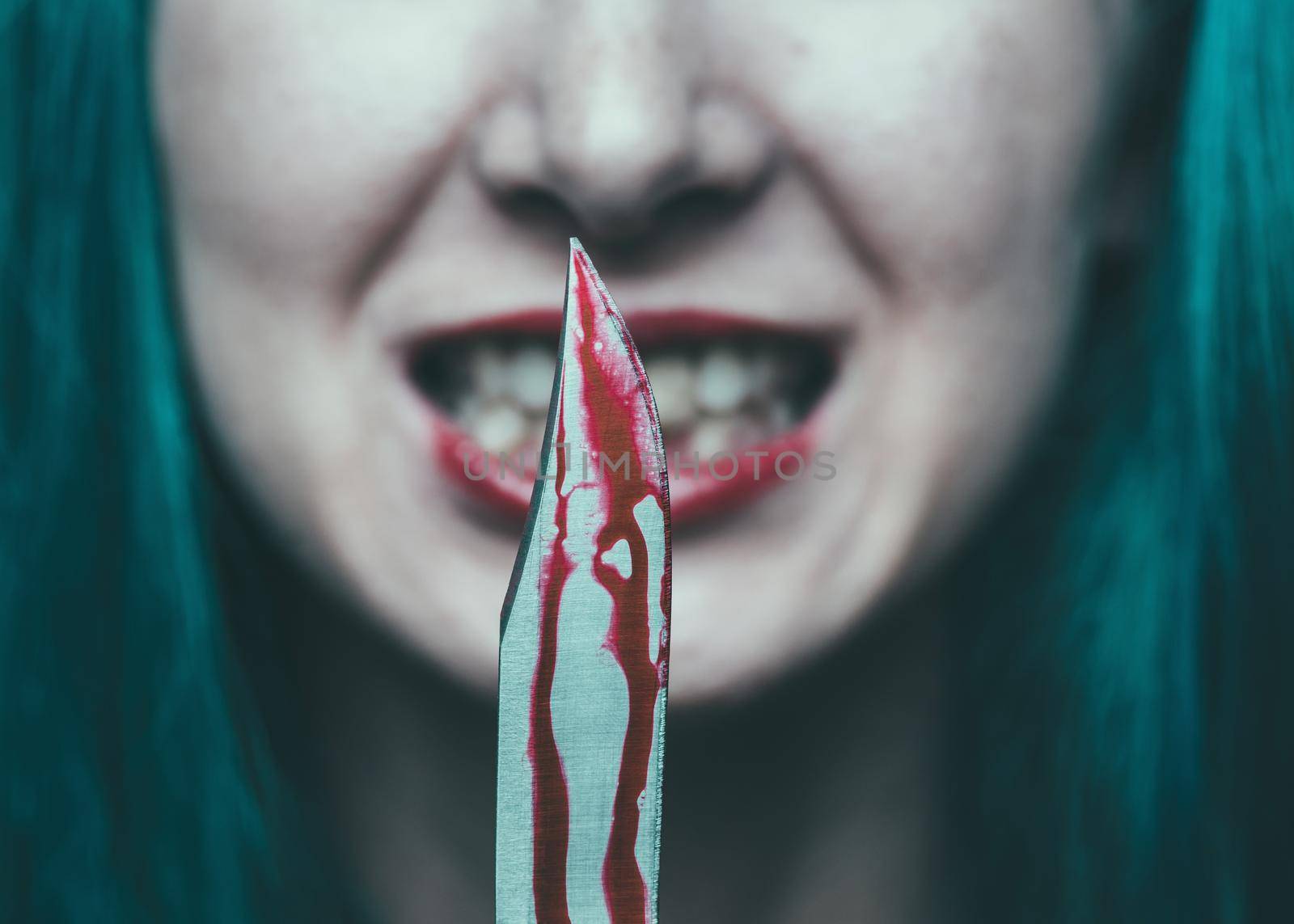 Spooky woman with knife in blood by alexAleksei