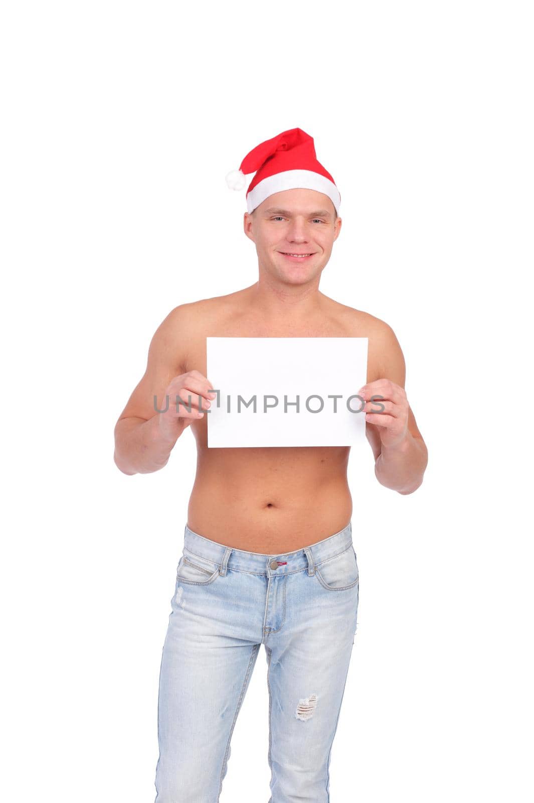 handsome young Christmas guy with the blank sheet of paper in his hands