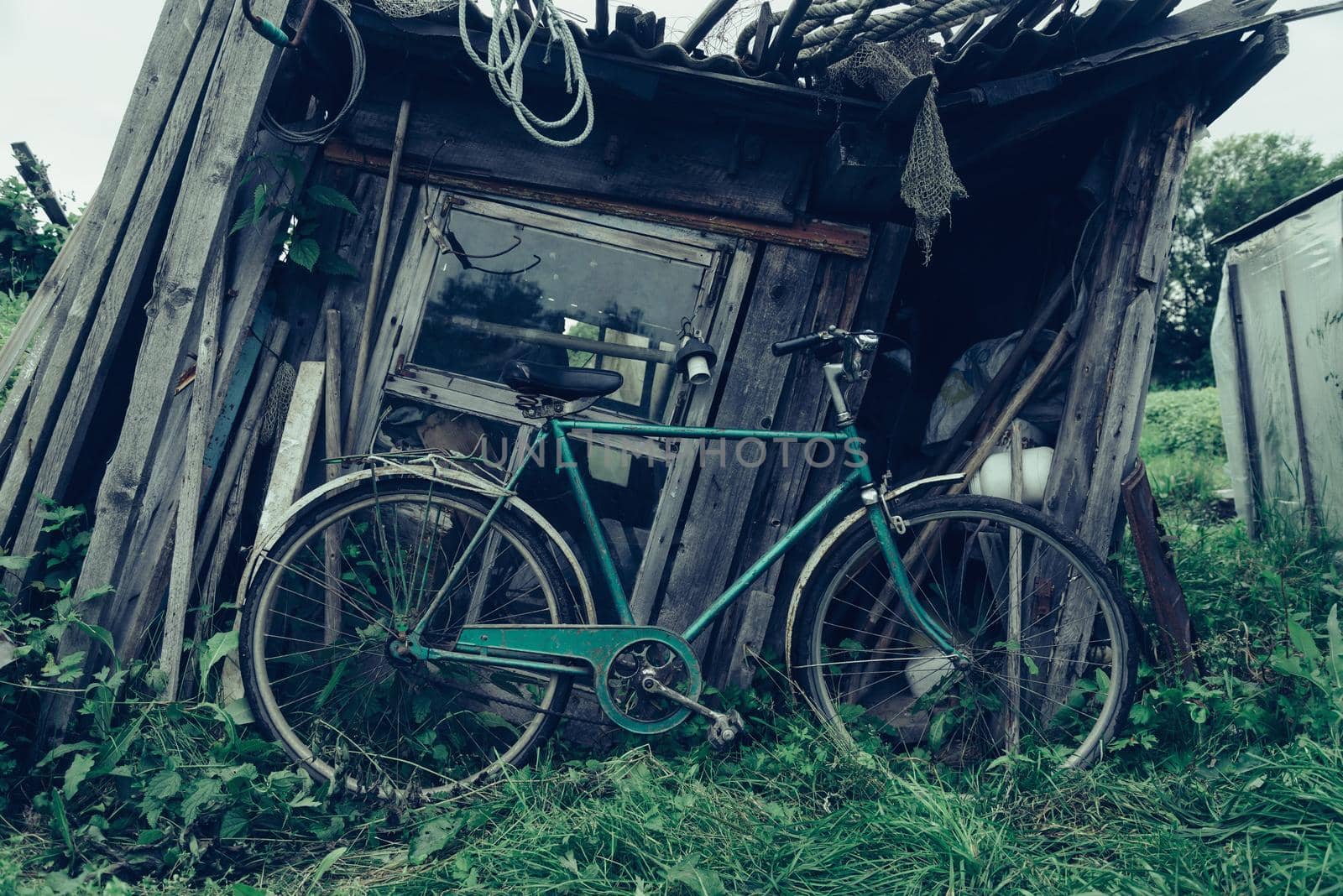 Bicycle on background of old barn outdoor