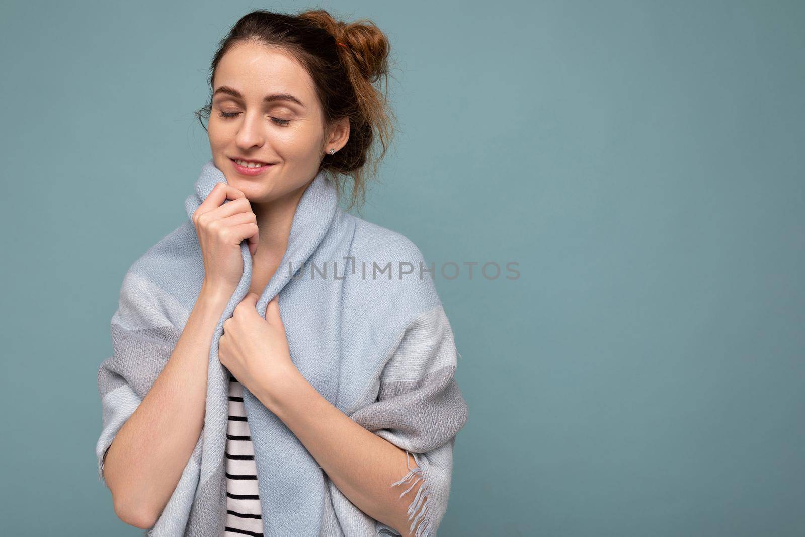 Young happy cute beautiful dark blonde woman with sincere emotions isolated on background wall with copy space wearing casual clothes. Enjoy concept.