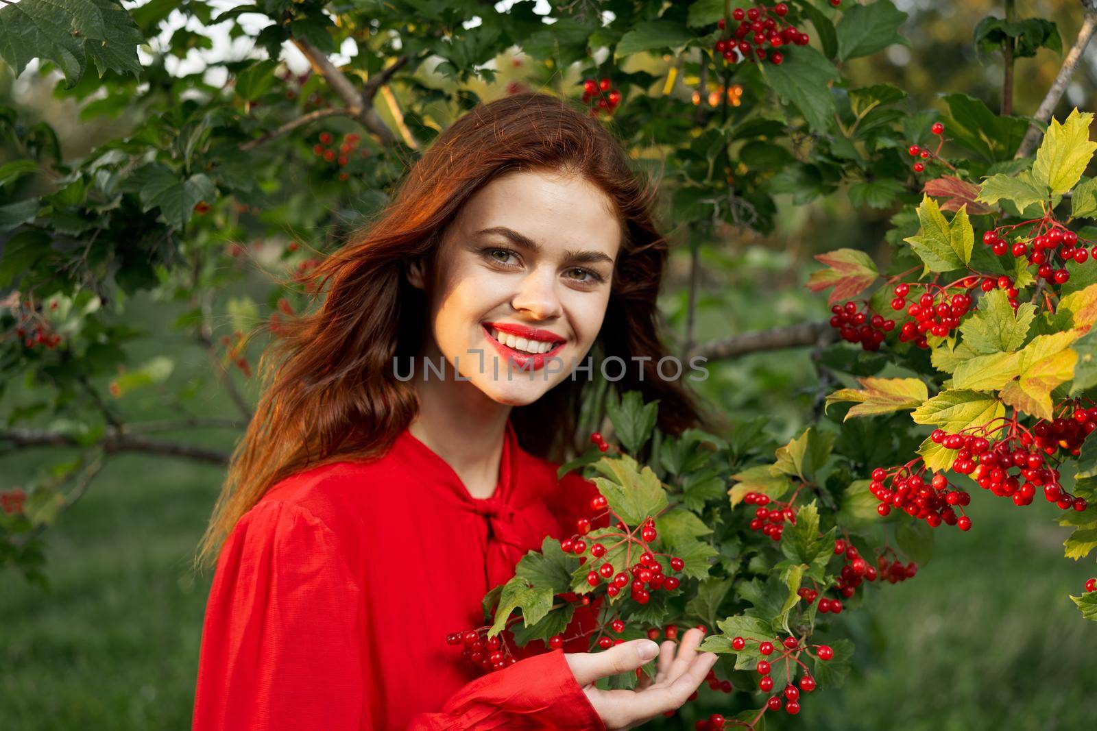 cheerful woman eating berries outdoors fresh air. High quality photo