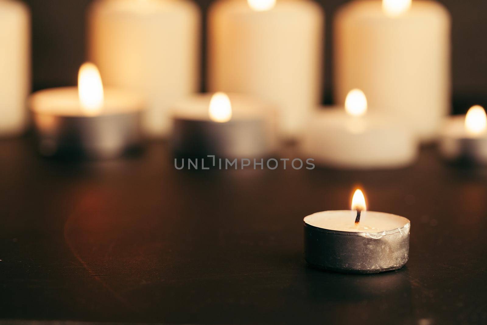Candles Burning at Night. White Candles Burning in the Dark