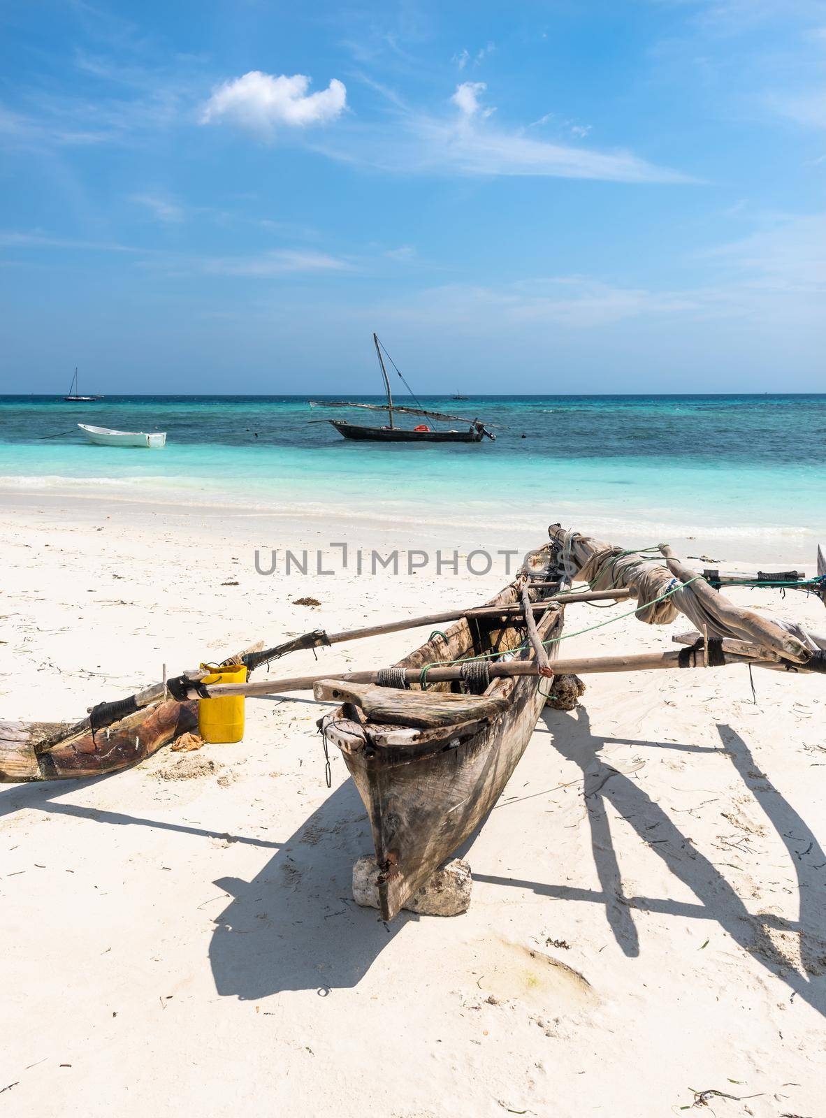 wooden canoe on the shore of Africa with ocean on the background