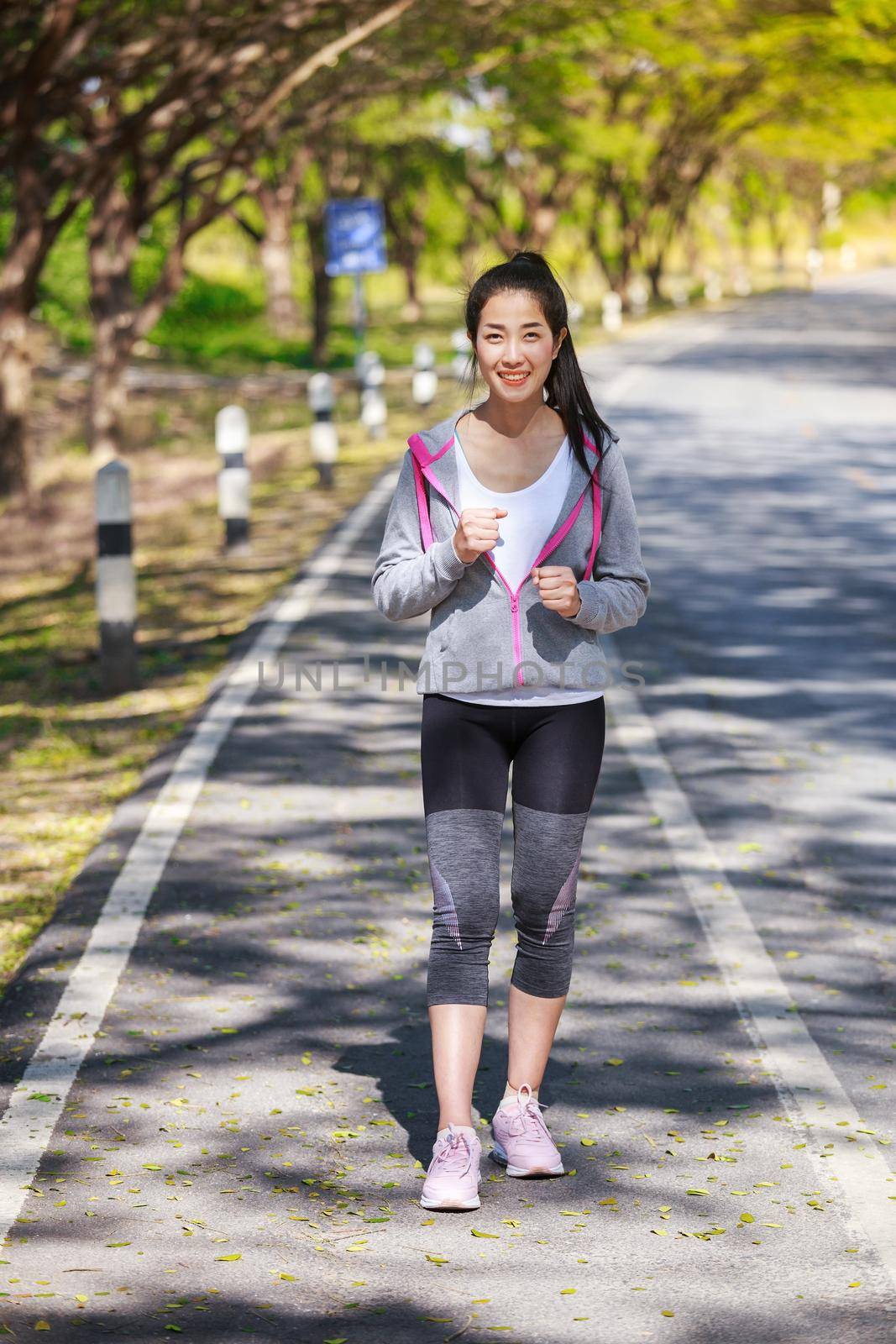 fitness woman running in park by geargodz