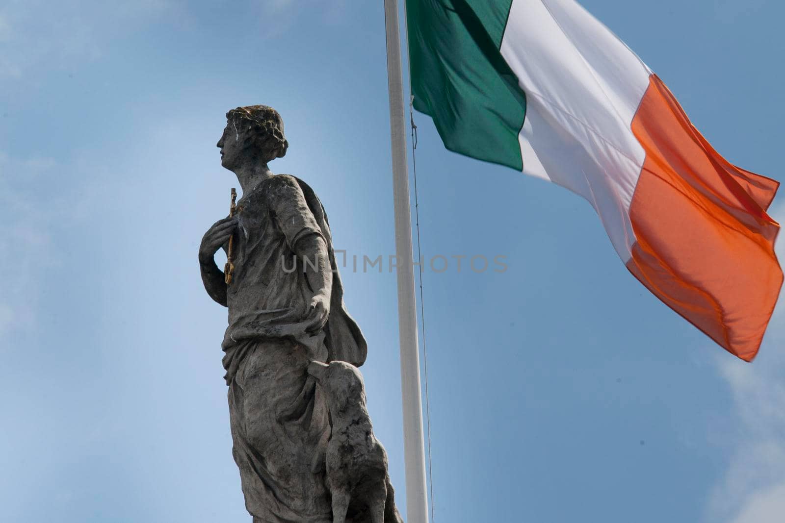 The statue of Fidelity with dog and the Irish tricolor on the General Post Office in Dublin Ireland