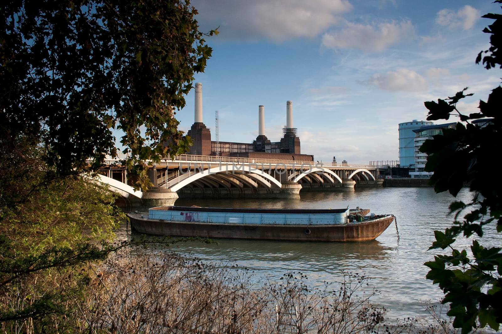 A Thames river barge Grosvenor Rail Bridge Battersea Power Station