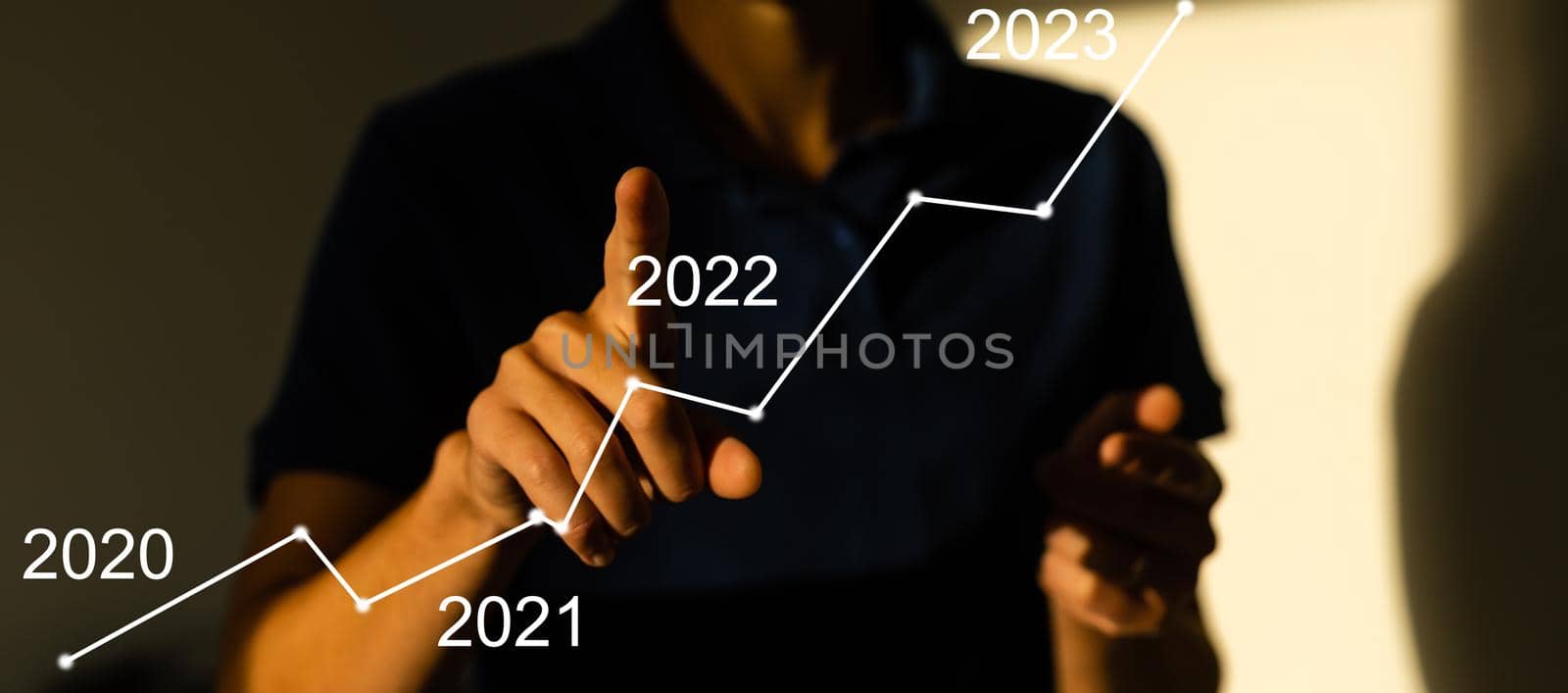 businessman hand working with virtual chart business on touch screen computer as concept by Andelov13