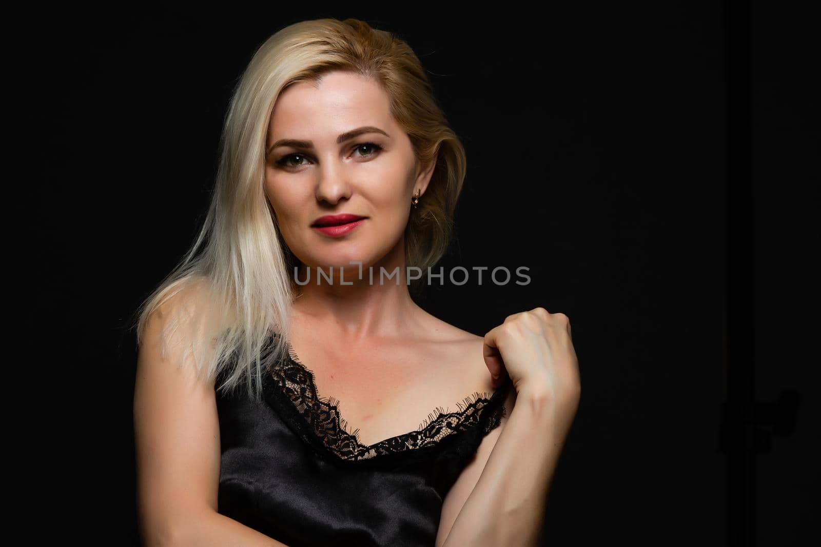 Beautiful blond woman on black