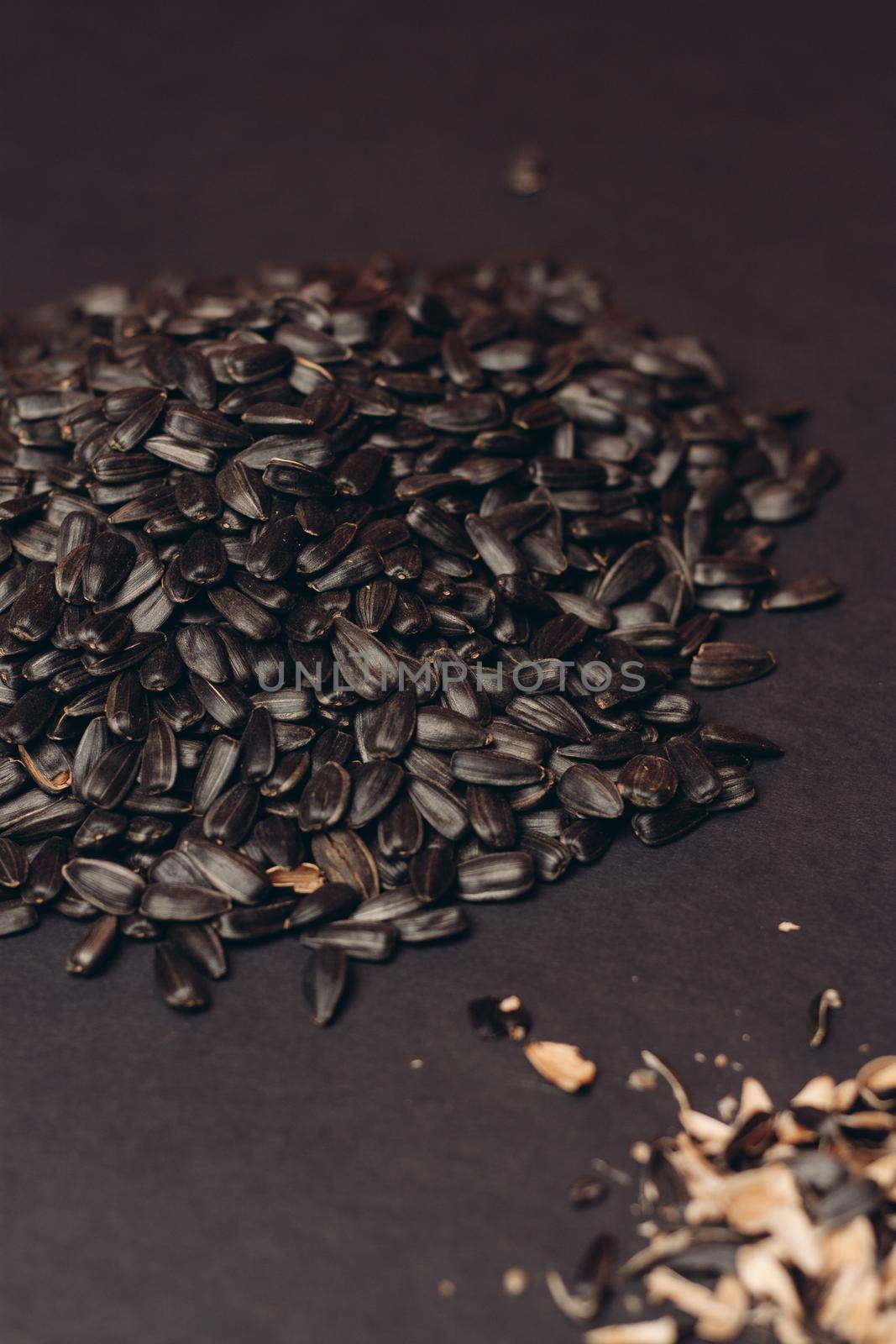 natural product sunflower seeds handing close-up food by Vichizh