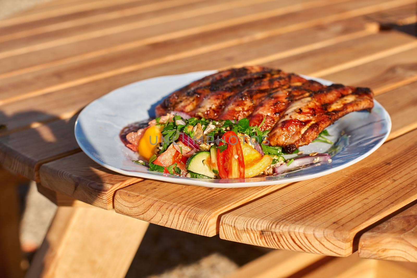 BBQ ribs sliced with hot honey and chili marinade, street food