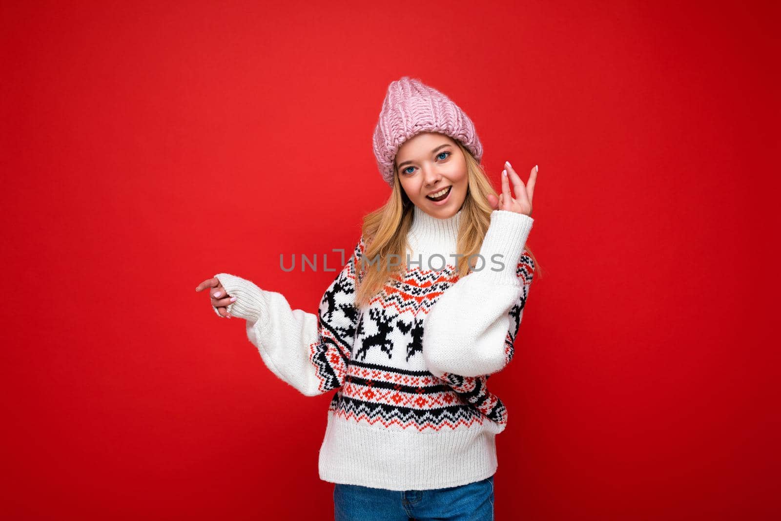 Photo of cute nice winsome positive adult woman wearing casual outfit isolated on background wall with copy space.