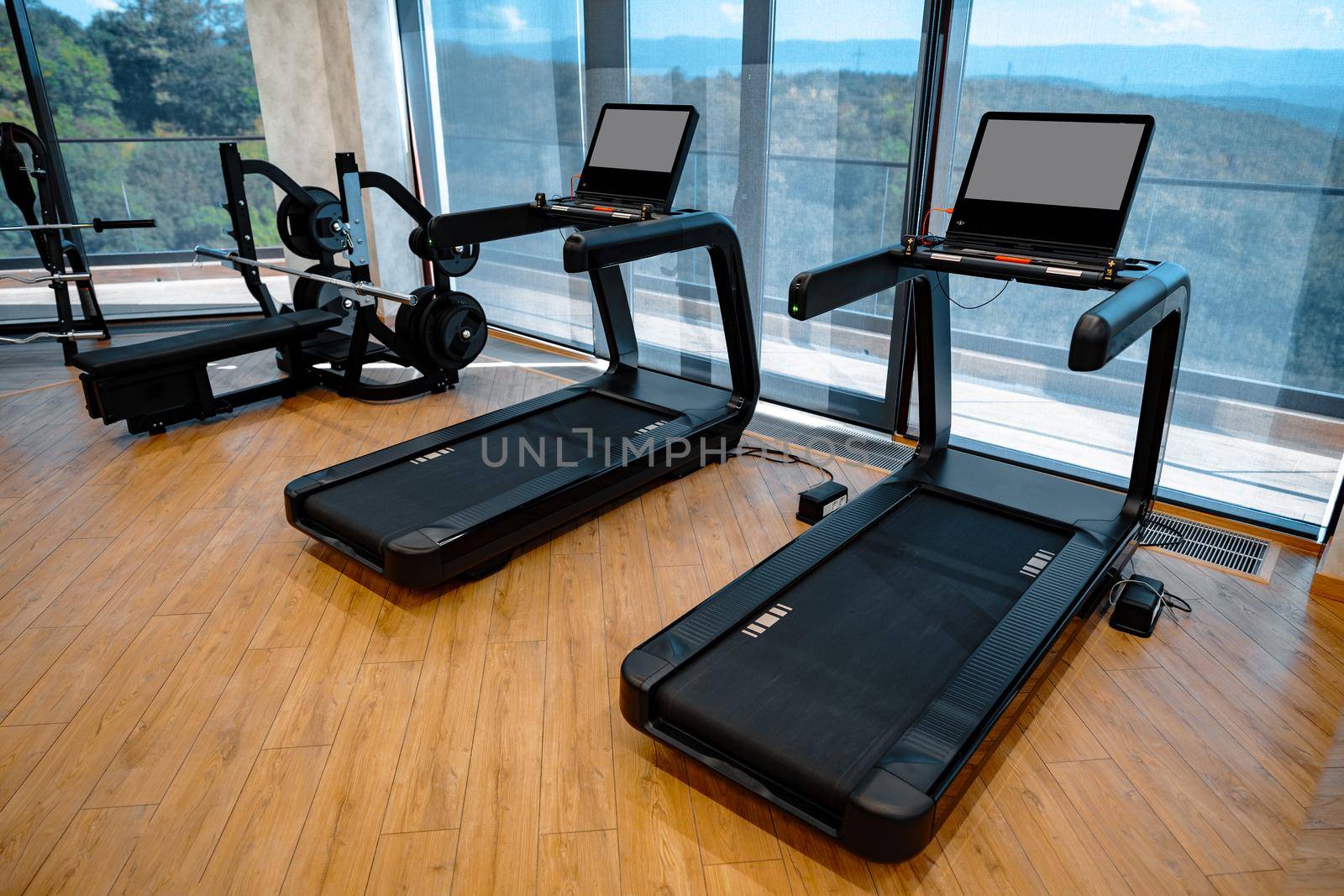 Studio shot of a professional treadmill in a modern gym