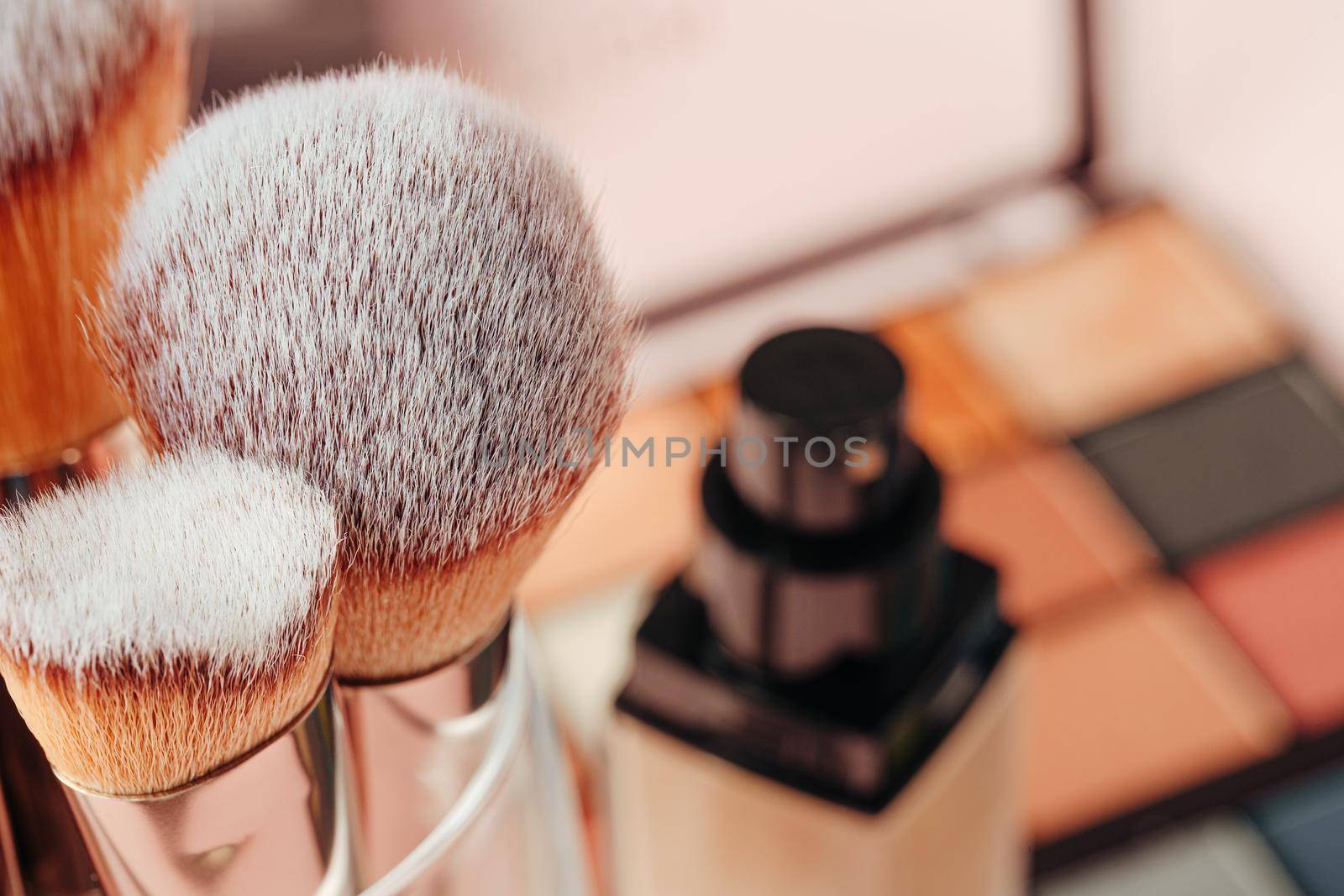 Make-up palette and brushes. Professional eyeshadow palette. Close up.