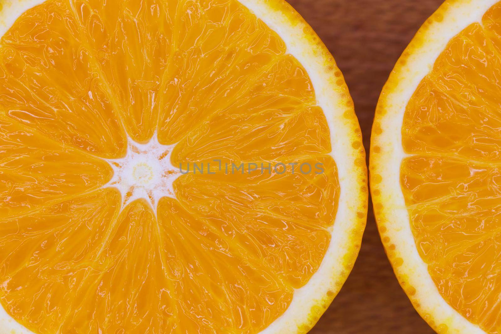 Fresh valencia orange (Citrus x sinensis) sliced citrus fruit flat-lay close-up