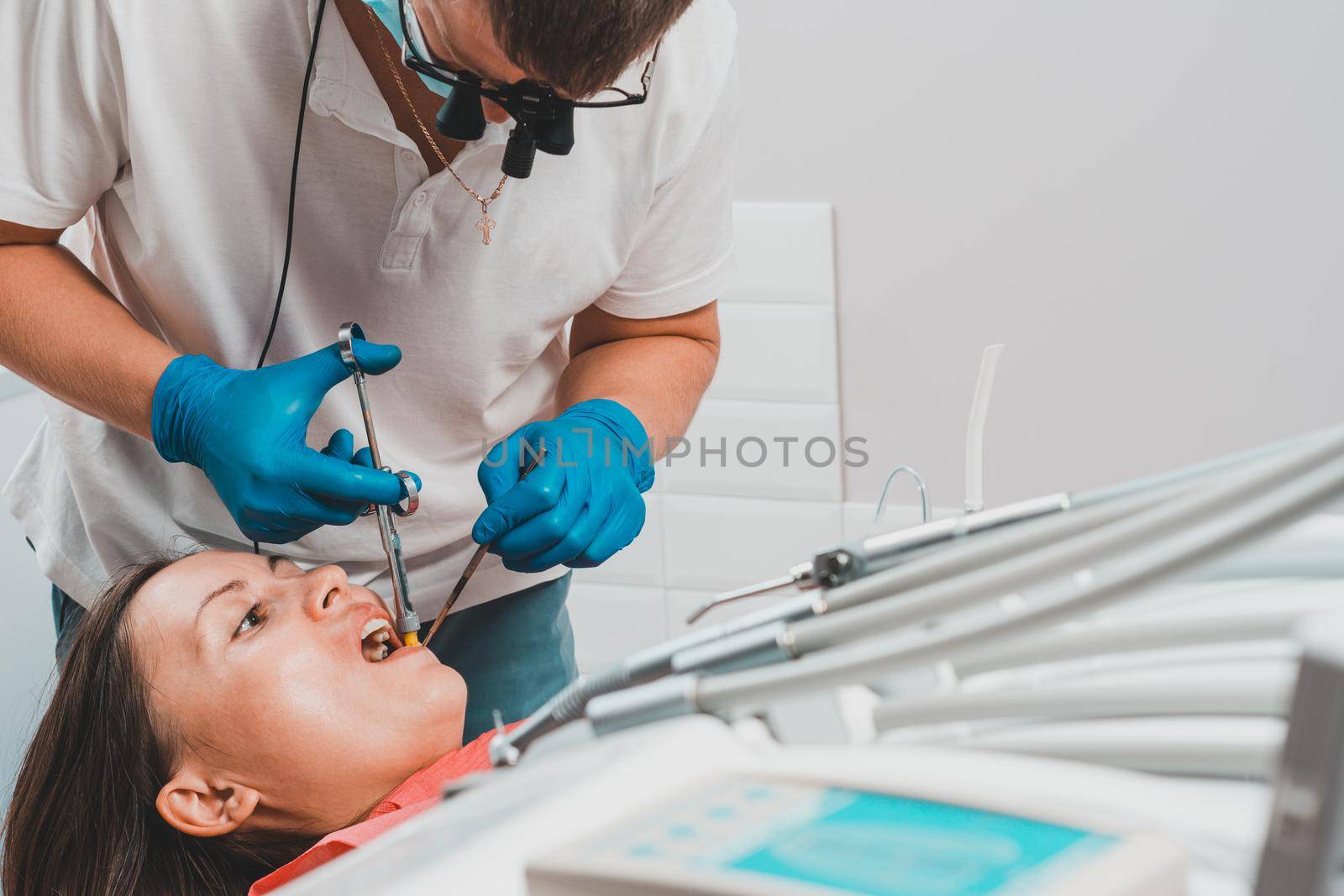 Local anesthesia, dentist carpal syringe injects the patient's gum anesthesia, dental carpule syringe. by Niko_Cingaryuk