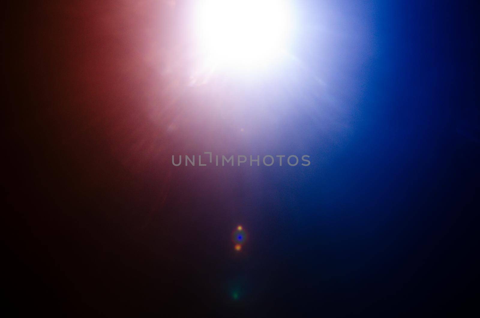 Abstract Natural Sun flare or Far star on the black background - image