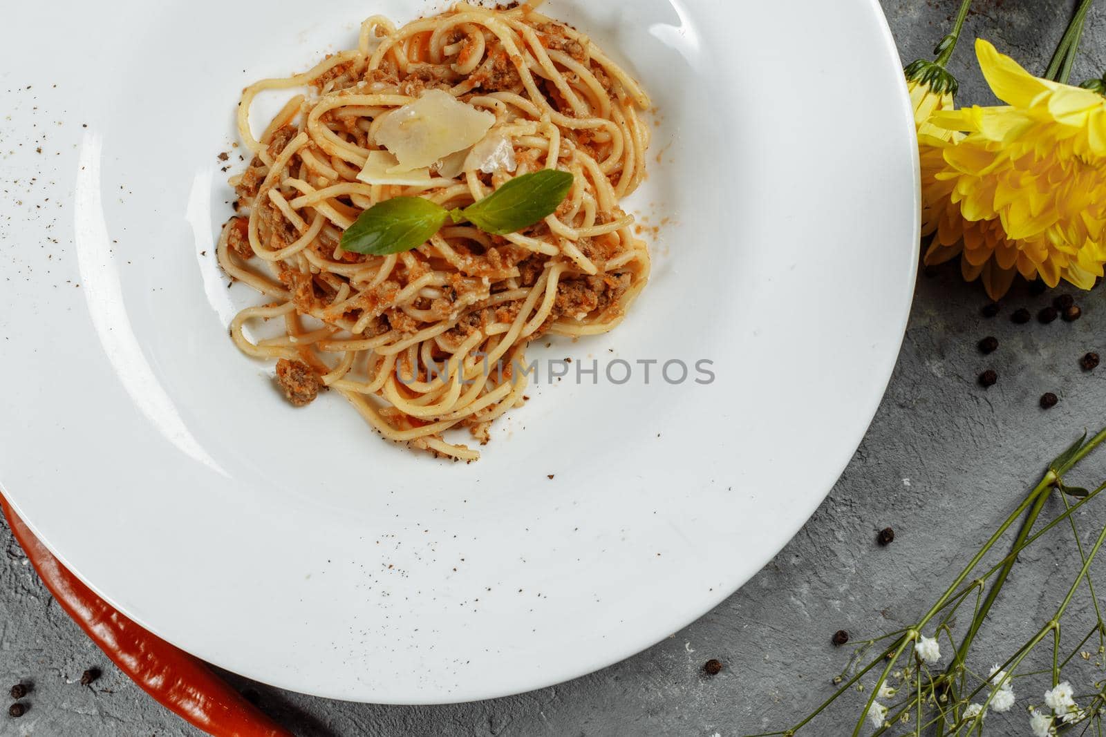 Spaghetti pasta with bolognese sauce and parmesan cheese, top view by UcheaD
