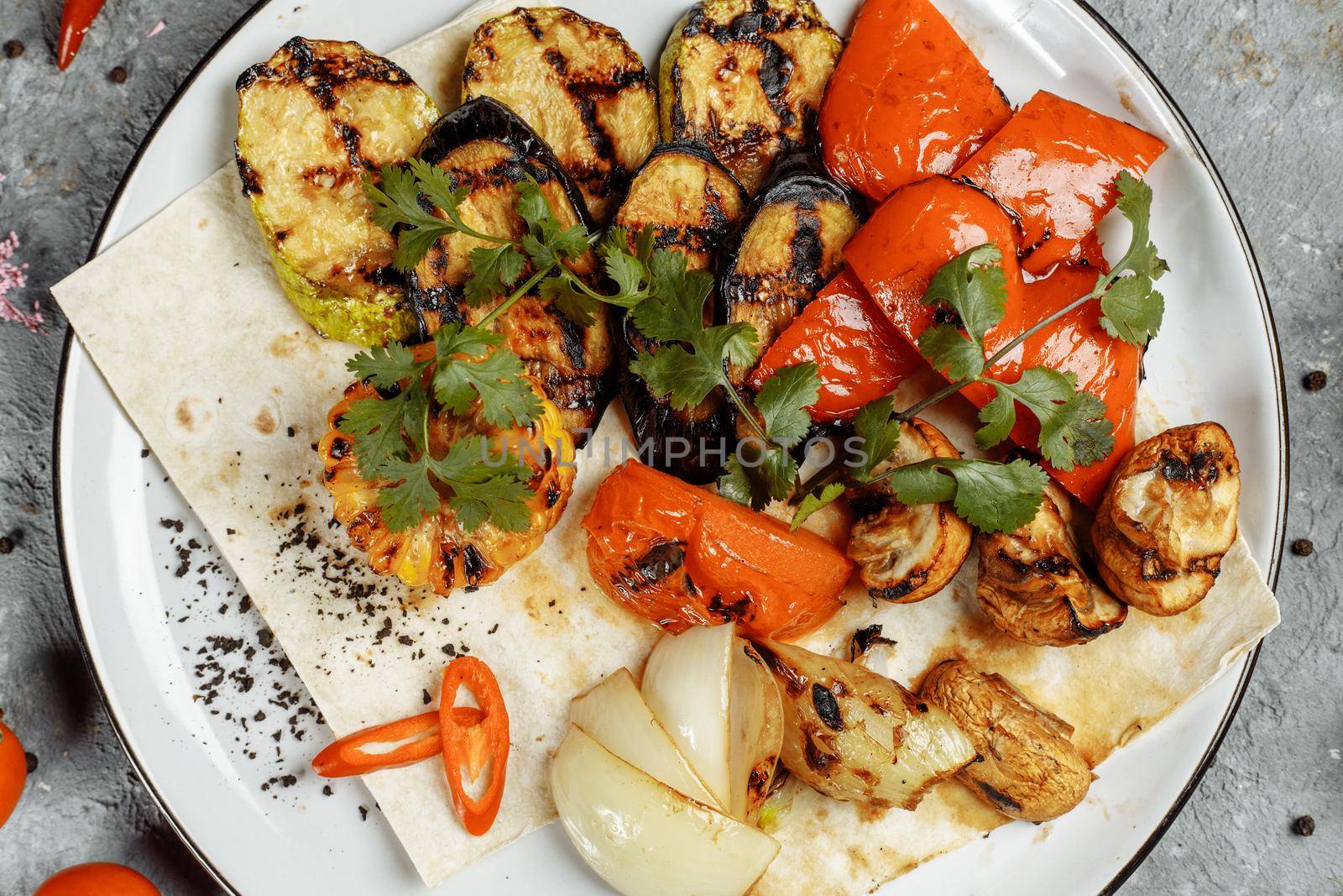 grilled vegetables on a white plate. Grilled fresh vegetables.