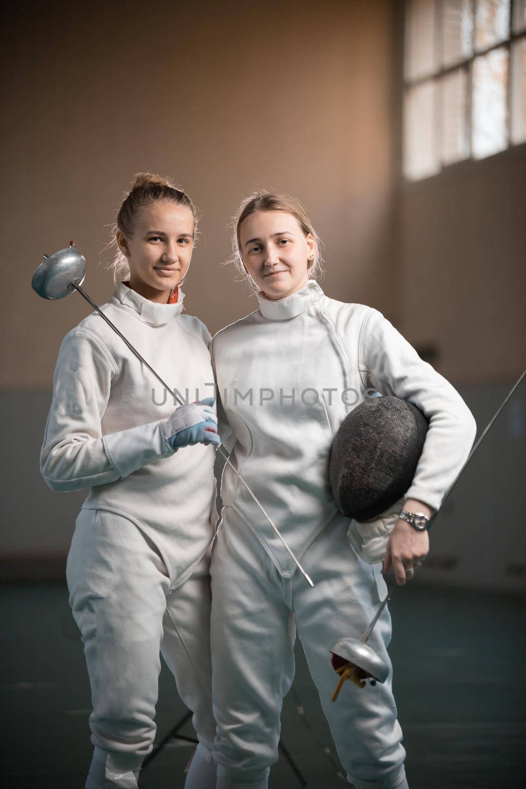A portrait of two young women fencers by Studia72