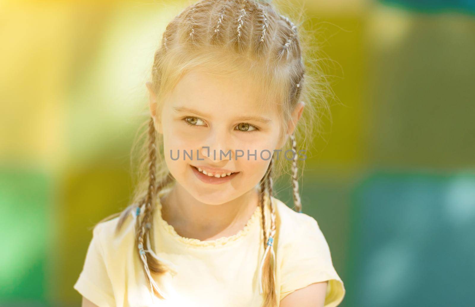 cute little girl smiling in the morning park by tan4ikk1