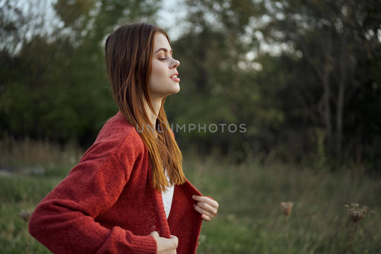 pretty woman in red sweater outdoors walk leisure by Vichizh