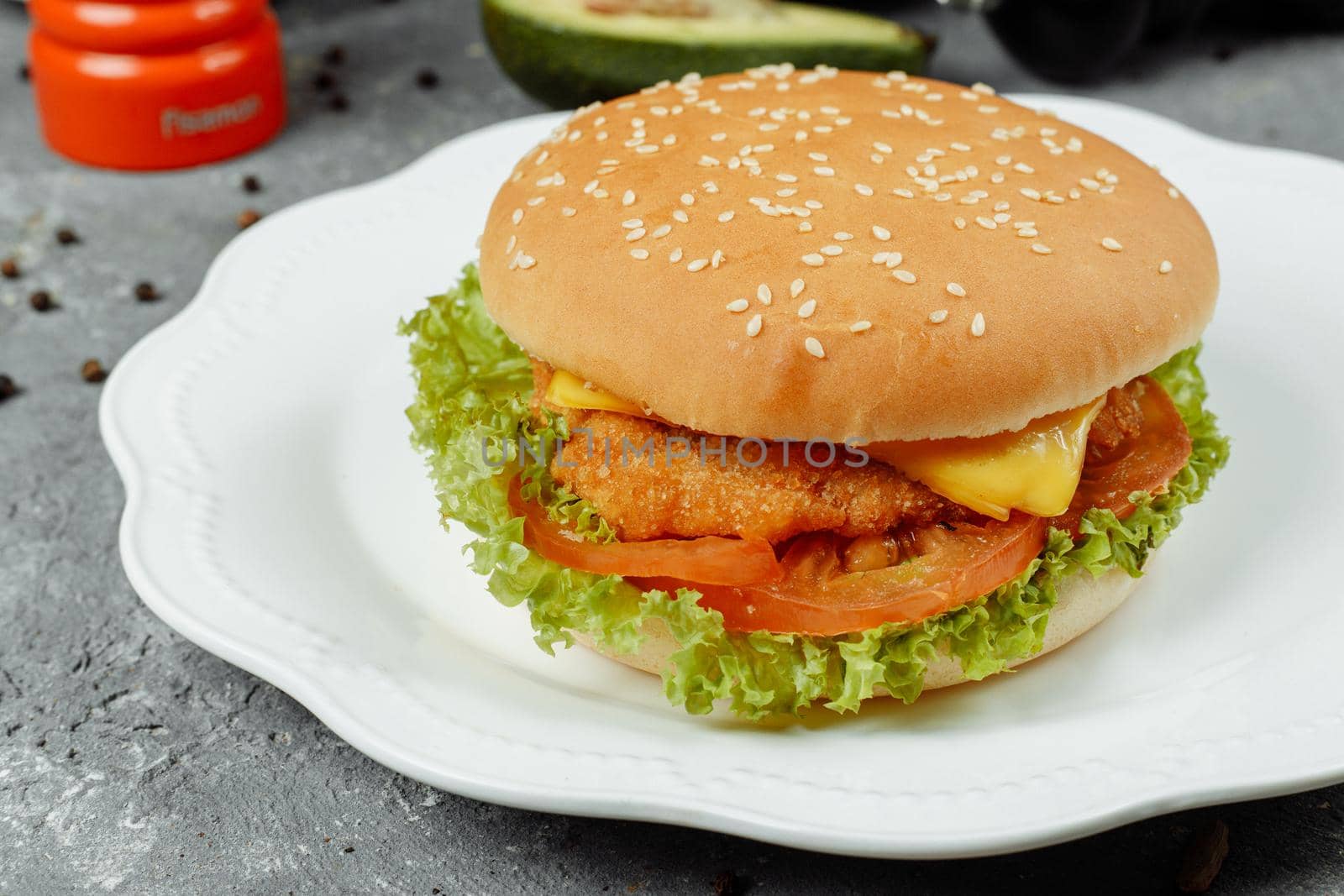 hamburger with fries and salad on the plate.