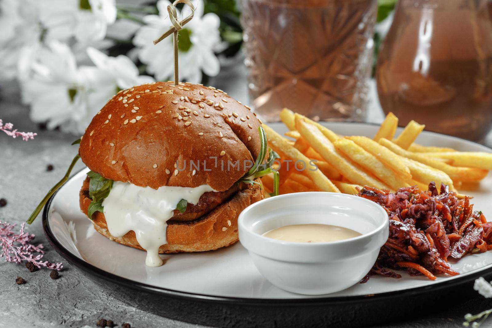 burger with fries and sauce on a white plate by UcheaD