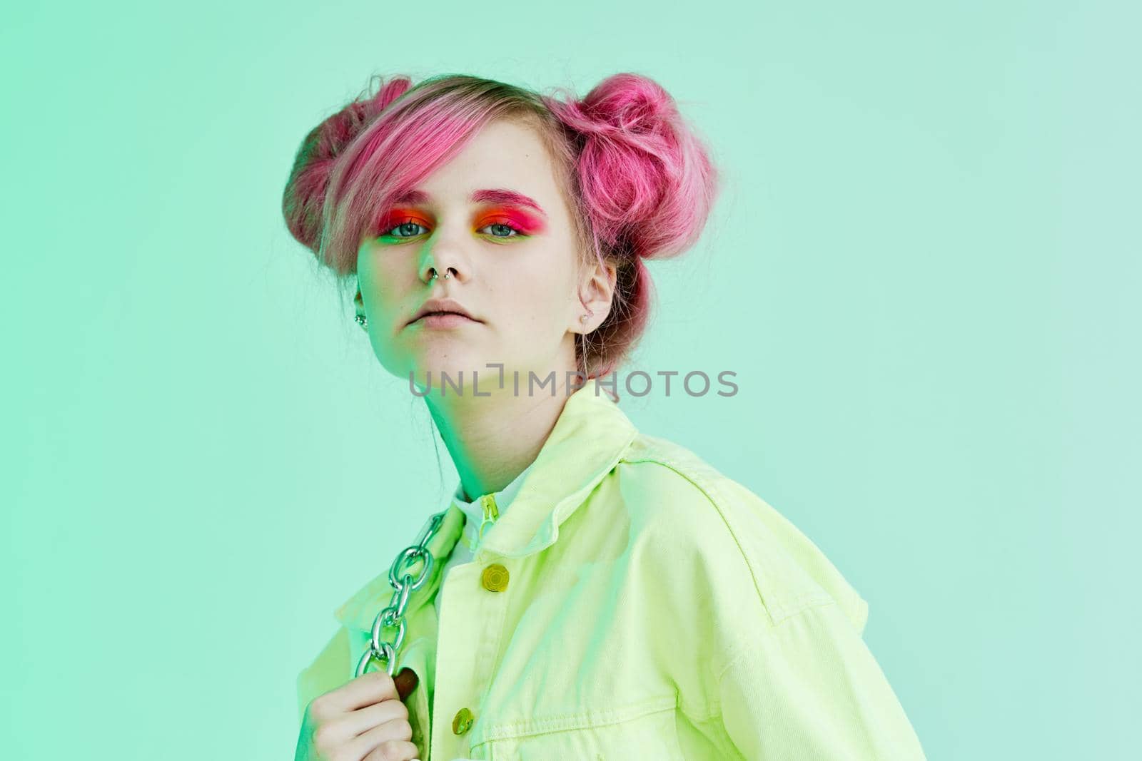 glamorous fashionable woman with pink hair posing hipster neon. High quality photo