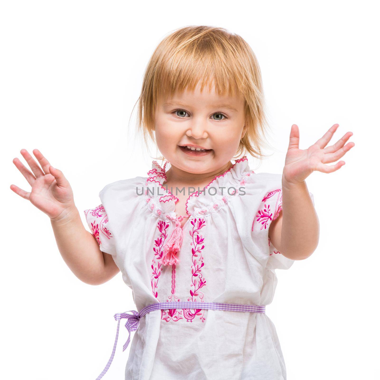 cute happy little baby girl in the national Ukrainian costume isolated over white background