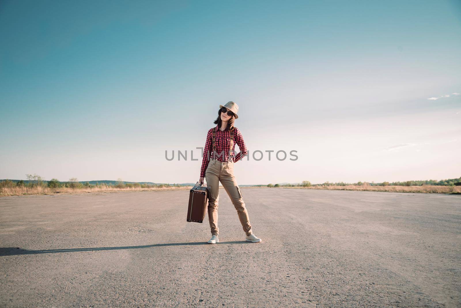 Traveler stands on road by alexAleksei